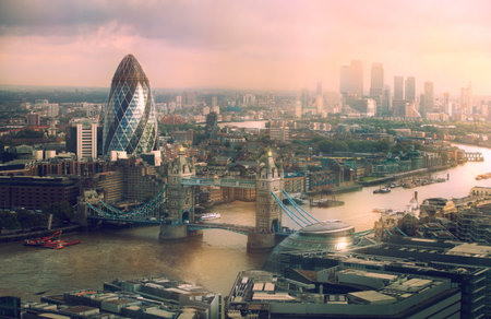 London view at sunset. Panorama include river Thames, Tower bridge and City of London and Canary...