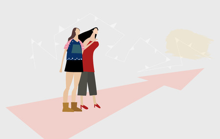 Two girls looking to the future and making decisions for themselves. Modern everyday life concept.の写真素材