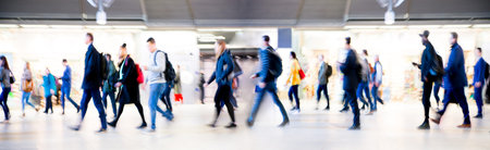 Beautiful motion blur of walking people. Early morning rush hours, busy modern life concept. Ideal...