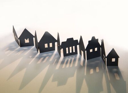 Little town houses in raw and beautiful shade. City concept. Paper cut design background.の写真素材