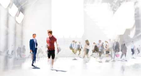 Lots of walking people in big exhibition place. Beautiful people blur image with space for textの写真素材