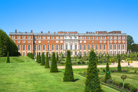 London, UK - July 29, 2019: English garden view and the East Front of Hampton court 17th century locates West Londonのeditorial素材