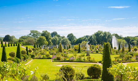 London, UK - July 29, 2019:  West London Bushy park. Beautiful english garden view, with lots of trees and flowers. English nature.のeditorial素材