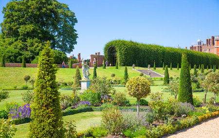 London, UK - July 29, 2019:  West London Bushy park. Beautiful english garden view, with lots of trees and flowers. English nature.のeditorial素材