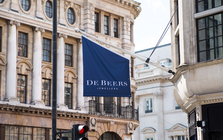 London, UK - August 13, 2019: Logo of the Alexander McQueen brand on the Old Bond Street at sunset, major shopping street in the West End of London for luxury designer brands and jewelsのeditorial素材