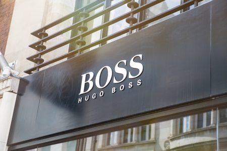 London, UK - August 13, 2019: Boss Logo brand and shop on the Old Bond Street, major shopping street in the West End of London for luxury designer brands and jewelsのeditorial素材