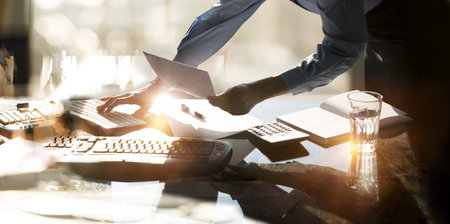 Young business woman working in office by desk. Business concept, work in progress, achievement and...