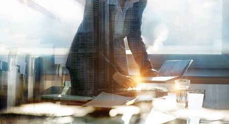 Portrait of business woman working in office by the desk. Business concept, work in progress, achievement and support.の写真素材