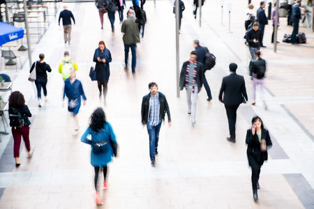 London, UK - April 26, 2019: Multiple exposure image of square in East London. Lots of people, office workers walking from tube to work. Busy life concept, business and travel.のeditorial素材