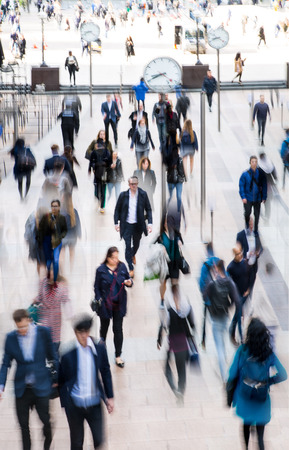 London, UK - April 26, 2019: Multiple exposure image of square in East London. Lots of people, office workers walking from tube to work. Busy life concept, business and travel.のeditorial素材
