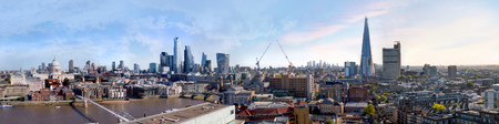 London view. River thames, millennium bridge, St. Paul's cathedral, modern skyscrapers of the City and Canary Wharf at the background. UK, 2019のeditorial素材