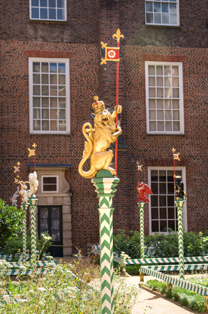 London, UK - July 29, 2019: Coat of arms, Dragons sculptures, representing power and authority. Inner yard of the Hampton court, locates in West London.のeditorial素材