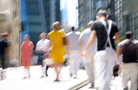 Beautiful motion blur of walking people. Early morning rush hours, busy modern life concept.の写真素材