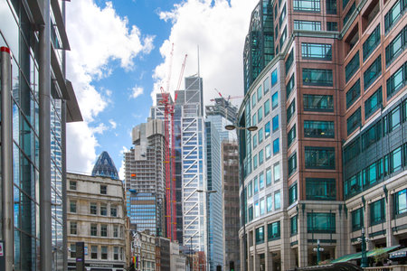 London, UK - 25 April, 2019: City of London busy street with view at the Gherkin building at the...