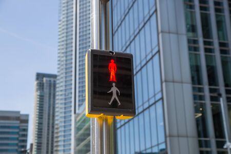 Traffic lights in Canary Wharf financial and banking area of london shows red. London during lockdown. UKの写真素材