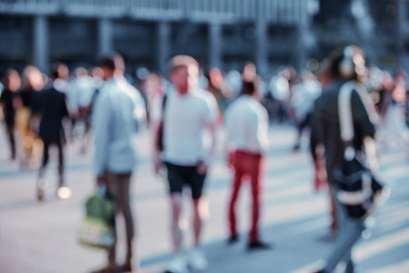 Beautiful background with motion blur people. People walking in the  City of London in early...