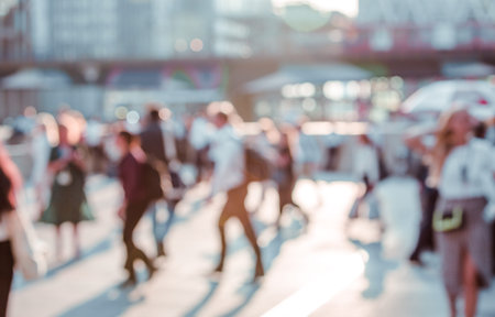 Beautiful background with motion blur people. People walking in the  City of London in early...