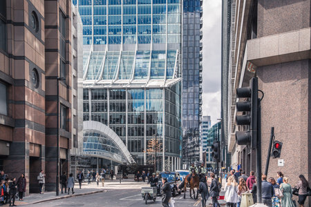 London, UK - April 25, 2019: Bishopsgate st. is one of the main streets in the City of London, business and banking are with distant view at skyscrapers and lots of walking peopleのeditorial素材