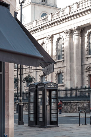 London, UK - February 23, 2021: British phone box. Empty London due to national lockdown
