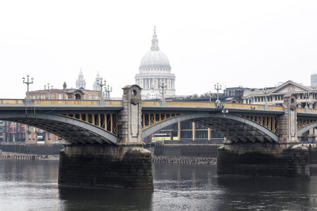 City of London and St. Pauls cathedral in raining, misty day view from the River Thames. Empty...