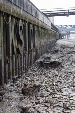 River Thames low tide. London in rain. Empty streets of London during national lockdown UK, 2021のeditorial素材