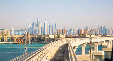 Dubai, UAE United Arabs Emirates - 29 May, 2019: Monorail at Palm Jumeirah with Dubai marina viewのeditorial素材