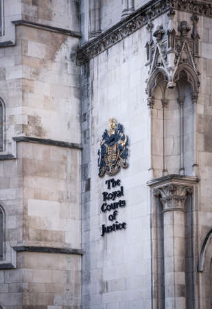 London, UK - February 23, 2021: Royal Courts of Justice. Built in the 1870s and opened by Queen Victoria in 1882. One of the largest courts in Europe. Facade architectural detail.のeditorial素材