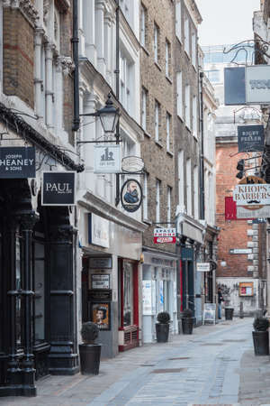 London, UK - February 23, 2021: Empty Bow line, popular destination for restaurants, shops and pubs in the  City of London during national lockdown. Covid restrictions, social distancing.のeditorial素材