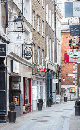 London, UK - February 23, 2021: Empty Bow line, popular destination for restaurants, shops and pubs in the  City of London during national lockdown. Covid restrictions, social distancing.のeditorial素材