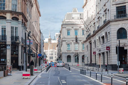 London, UK - February 23, 2021: Monument tube station and empty streets City of London during national lockdown. Covid restrictions, social distancing.のeditorial素材