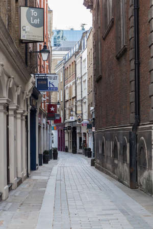 London, UK - February 23, 2021: Empty Bow line, popular destination for restaurants, shops and pubs in the  City of London during national lockdown. Covid restrictions, social distancing.のeditorial素材