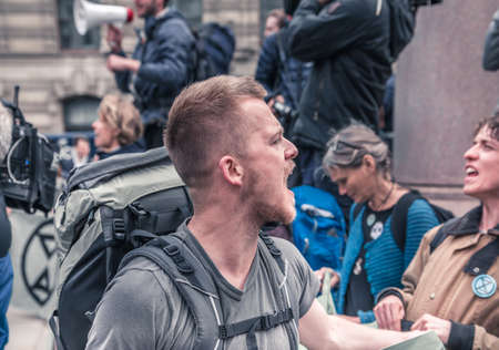 London, UK - 25 April, 2019: Young man shouting at Rebel for Life protest  in the City of Londonのeditorial素材