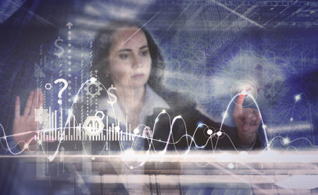 Business woman works with financial graphs on the virtual screen. Modern technology and digital...