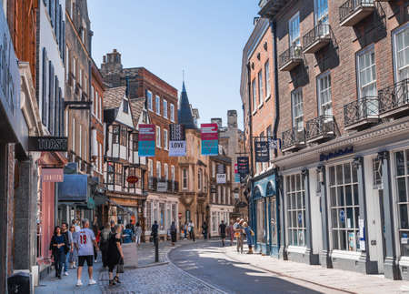 Cambridge, UK - July 16, 2021: St Johns street view with lots of shops and tourists walking through the townのeditorial素材