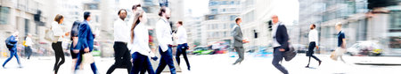 Walking people blur wide background. Lots of people walking in the City. Business concept...