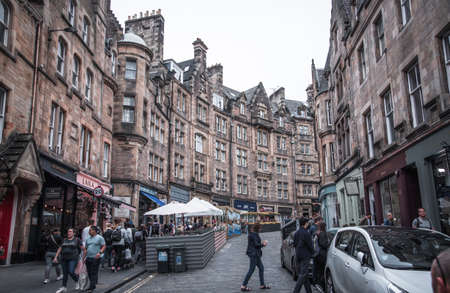 Edinburg, UK - August 23, 2021: Cockburn street with lots cafes and restaurants and walking peopleのeditorial素材