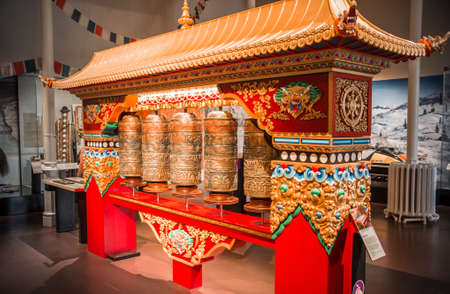 Edinburg, UK - August 23, 2021: National history museum interior. Traditional culture, Tibetan pray drumsのeditorial素材