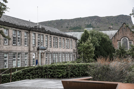 Edinburg, UK - August 23, 2021: University of Edinburg buildings and Holyrood hills at the backgroundのeditorial素材