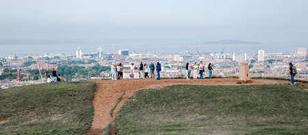 Edinburg, UK - August 23, 2021: People looking over the sea from Calton hillsのeditorial素材