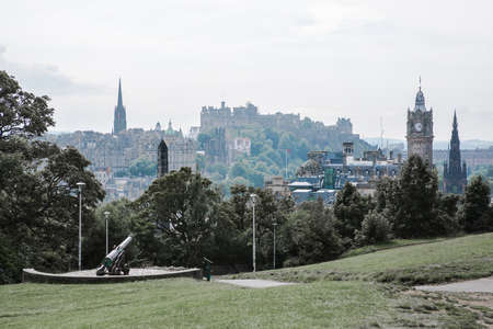 Edinburg, UK - August 23, 2021: Edinburg view from Calton hill. View include Edinburg castle, Balmoral hotel tower, Dugald Stewart Monument and people relaxing in Claton hillのeditorial素材