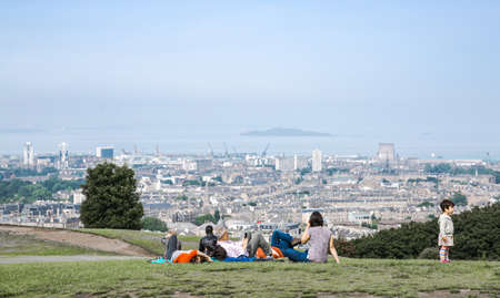 Edinburg, UK - August 23, 2021: People looking over the sea from Calton hillsのeditorial素材