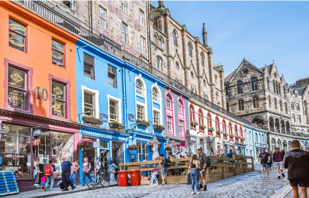 Scotland, Edinburg - August 24, 2021: Victoria street with beautiful curve and colourful shopfronts....