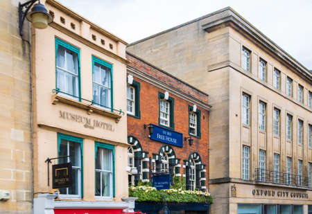 Oxford, UK - June2, 2021: High street view with shops and cafes and walking peopleのeditorial素材