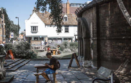 Cambridge, UK - July 16, 2021: St. Mary's street, people and tourists walking by shops and cafesのeditorial素材