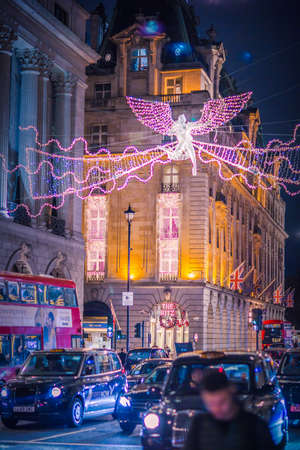 London UK - November 18, 2021: Ritz hotel,  Festive decorations and Christmas lights at Piccadilly street.のeditorial素材