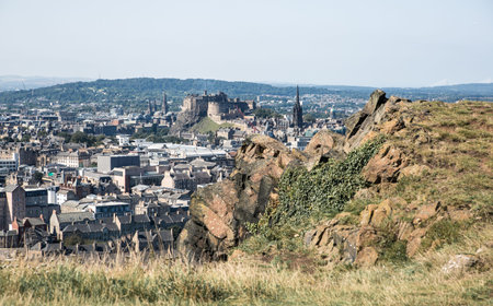 Scotland, Edinburg - August 26, 2021: Edinburgh old city view from the Arthur's sit, nature Holyrood...
