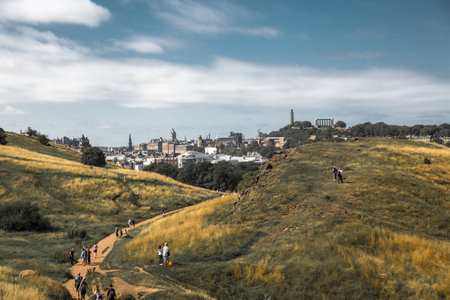 Scotland, Edinburgh, UK - August 26, 2021: Holyrood park and ancient volcano. City of Edinburgh view from the mountainのeditorial素材