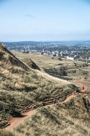 Scotland, Edinburgh.  Holyrood park and ancient volcano. Beautiful panoramic view City of Edinburgh  from the mountainの写真素材