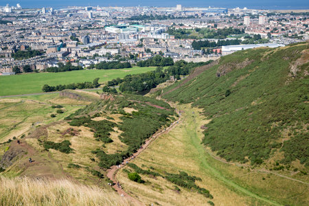 Scotland, Edinburgh.  Holyrood park and ancient volcano. Beautiful panoramic view City of Edinburgh  from the mountainの写真素材