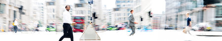 Lots of people walking on the city street. Blurred long time exposure image representing busy life...